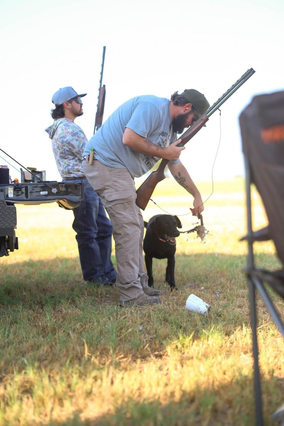 Hunters loading shotguns at the truck before a Texas dove hunt